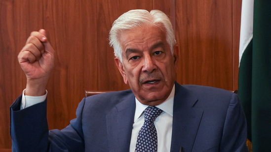 Pakistan's Defence Minister Khawaja Muhammad Asif gestures during an interview with Reuters in Islamabad